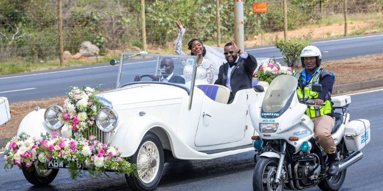 A Photo Showing Mudavadis Son And His Wife Alongside A Police Officer. Photo/ The Kenya Times