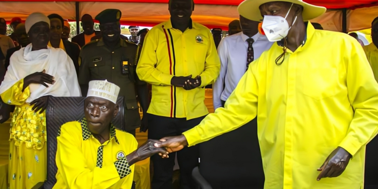 Ugandan Mp Moses Ali (Seated) And President Yoweri Museveni At Past Political Event.