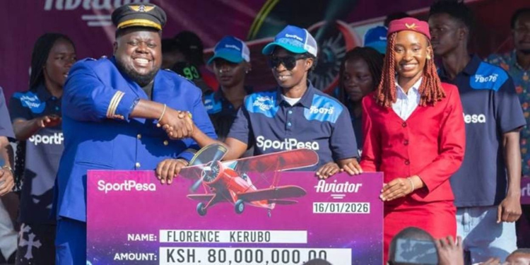 Mega Jackpot Winner Florence Kerubo Receives Her Sportpesa Cheque. Photo/Sportpesa