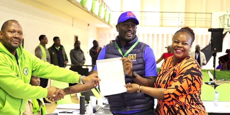 A Photo Of Edwin Sifuna With His Wife Receiving His Certificate As The Senator-Elect. Photo/ X Sifuna