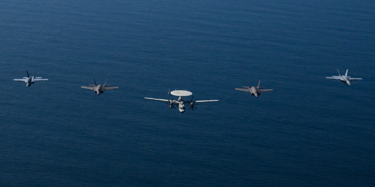 Abraham Lincoln Carrier Strike Group, Accompanied By Two Military Supply Ships, And Two U.s. Coast Guard Cutters, Sailing Together In The Arabian Sea Photo/ United States Central Command