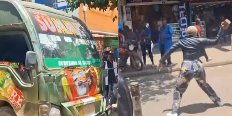 A Photo Showing A Woman Smashing A Matatu'S Windscreen . Photo/Hussein Khalid X
