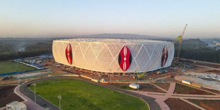 A Wide-Angle View Of The Stadium Exterior, Showing The Kenyan Emblems On The Façade And Ongoing Landscaping Works/