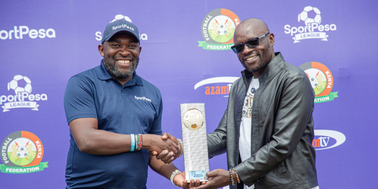 Former Shabana Fc Coach Peter Okidi (Right) Receives His Sportpesa League Coach Of The Month Award From Sportpesa Partnerships And Sponsorships Manager Japheth Akhulia
