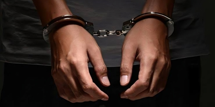 A Person Handcuffed After Arrest .Photo/ George Diago/X