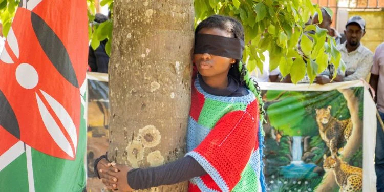 Truphena Muthoni Breaks Guinness World Record After Hugging Over 1,200 Trees In One Hour