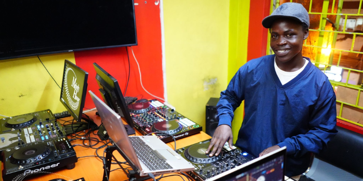 A Student Practicing Beat-Matching On Pioneer Dj Equipment At The Music And Film Academy In Nairobi, The Top-Rated Dj Academy In Kenya.
