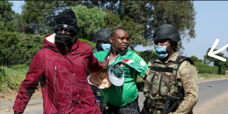 A Security Officer Dressed In British Military Uniform Seizes A Demonstrator During Ebola Protests In Nanyuki, June 9, 2026. Photo/ Uk Embassy