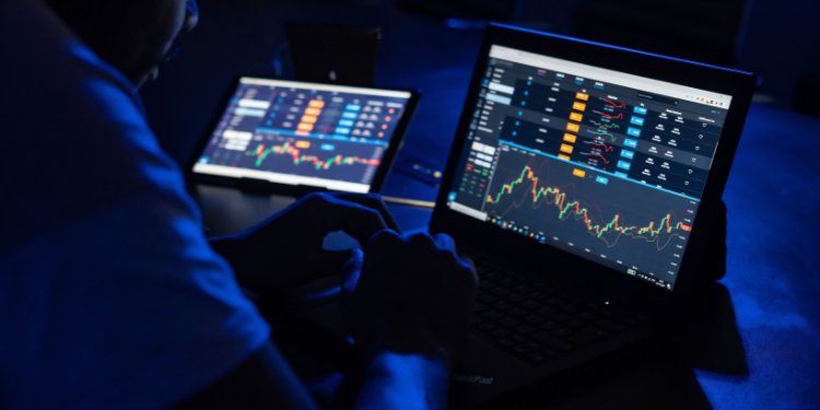 Kenyan Trader Reviewing Online Market Charts Before Choosing A Mobile Trading Platform.