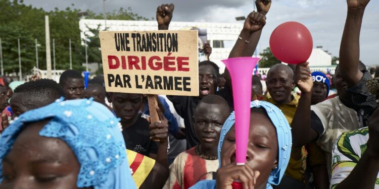 Mali Junta Calls Protests Against Sanctions Malians Rally In Support Of The Junta Several Weeks After The 2020 Coup. The Sign Reads: 'A Transition Led By The Army' | Afp