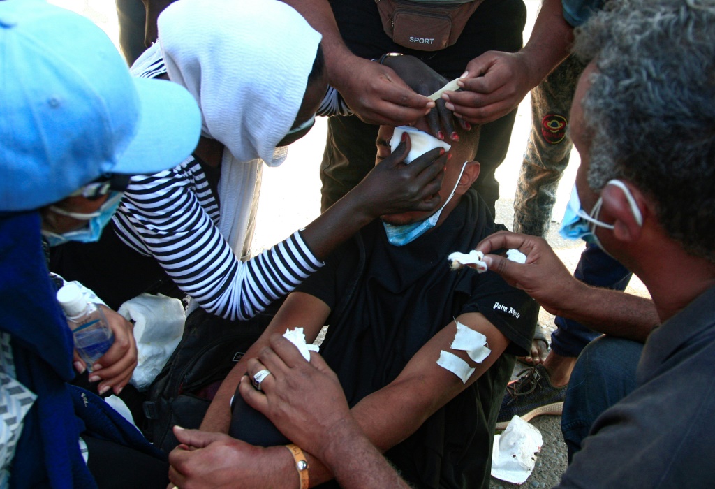 Sudanese Protesters Treat A Young Man'S Wounds At The Scene Of Confrontations With Security Forces, In The Capital Khartoum On December 25, 2021, During A Demonstration Demanding Civilian Rule | Afp