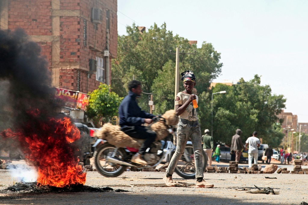 Sudanese Demonstrators Barricade A Street In Khartoum Tuesday Amid Ongoing Protests Against A Military Coup | Afp