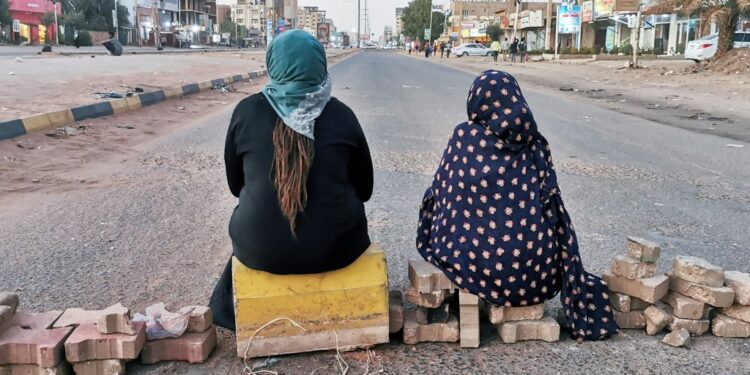 Senior Us Diplomats In Sudan For Talks On Coup Crisis Sudanese Women Sit Atop A Brick Barricade At 60Th Street On January 18, 2022 In The Capital Khartoum As Part Of A Civil Disobedience Campaign Following The Killing Of Seven Anti-Coup Demonstrators | Afp