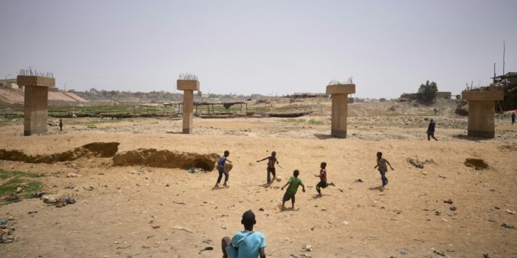 Children Playing Football In A Dry Arm Of The Inner Delta Of The Niger River, March 19, 2021 | Afp