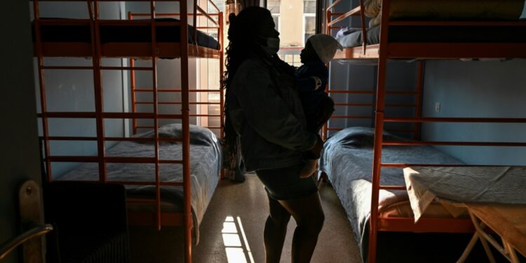 Abused Refugee In Greece Says 'No Longer Afraid To Speak Up' Congolese Refugee And Domestic Violence Victim Ruth Holds The Youngest Of Her Three Sons In A Shelter For Abused Women In Athens | Afp