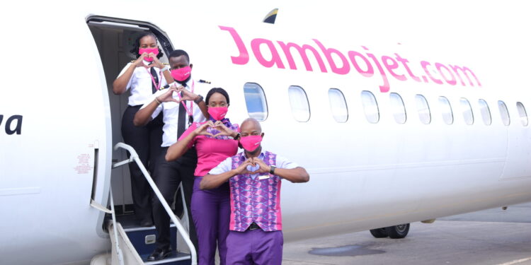 Jambojet Staff Pose For A Photo On A Plane Before Takeoff. 