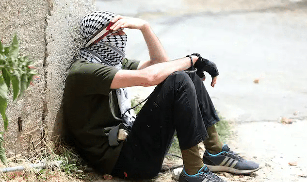 Gareth Evans: The Case For Recognizing Palestine A Palestinian Protester Rests During Clashes With Israeli Troops After A Demonstration Against Israel’s Settlements, Near Nablus, West Bank, June 9, 2023 | Alaa Badarneh/Epa