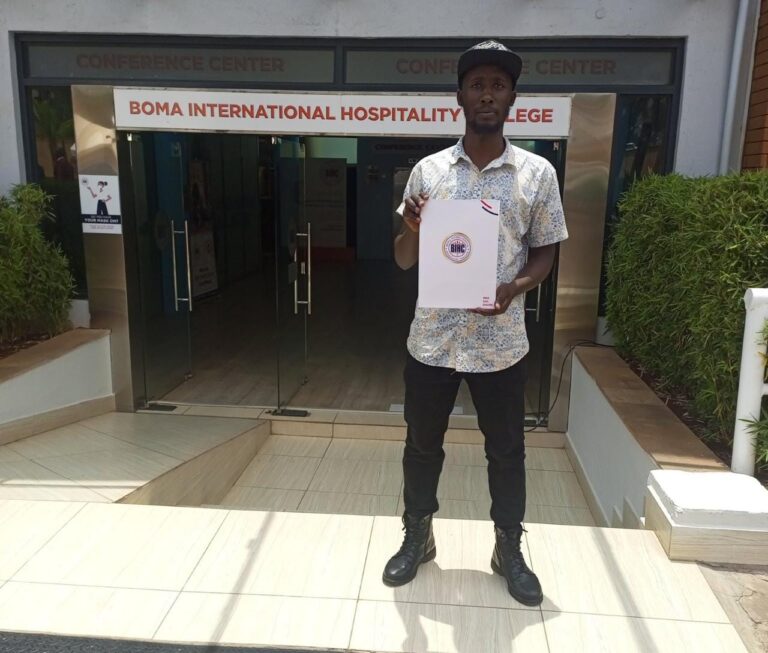 Masao Poses For A Photo After Applying For A Culinary Diploma Course At The Boma College. 