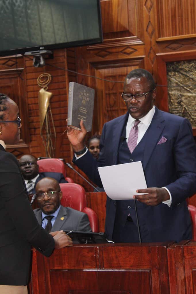 Ict Cabinet Secretary Eliud Owalo Takes An Oath Before Answering Questions On Worldcoin Registration In Kenya. 