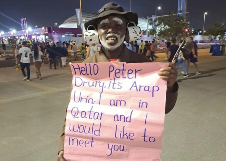 Arap Uria Holding A Banner During The 2022 World Cup In Doha, Qatar. 