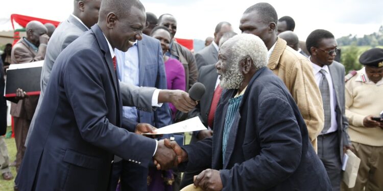 President Wiliam Ruto Issuing A Title Deed. Photo|Psc|X
