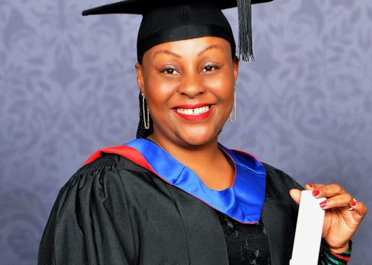 Amwik Director Patience Nyange Poses For A Photo.