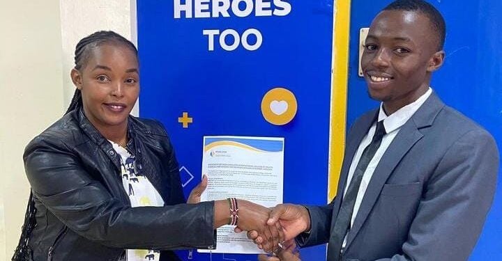 Kennedy Rioba Also Known As Babushka (Right) Receives A Certificate After Signing An Ambassadorial Deal.