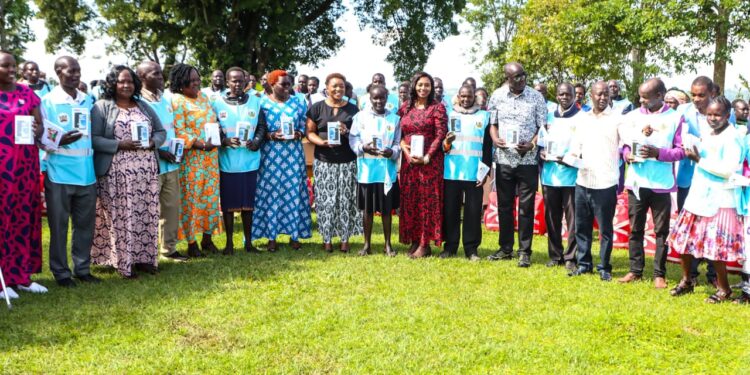 Former Health Cs Nakhumicha Poses Alongside Chps Who Received The Locally Assembled Smartphones. Photo/Min Of Health.