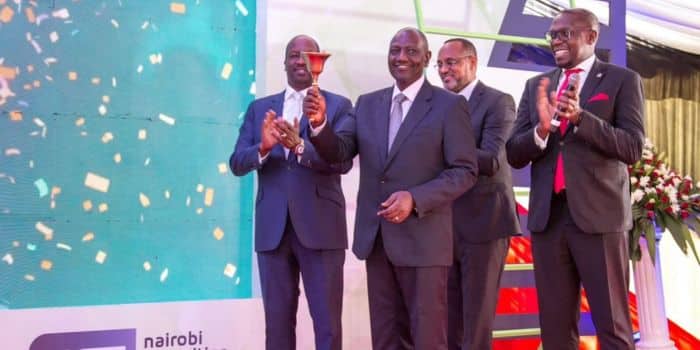President William Ruto (Center) Rings The Bell During His Past Visit To The Nairobi Stock Exchange.