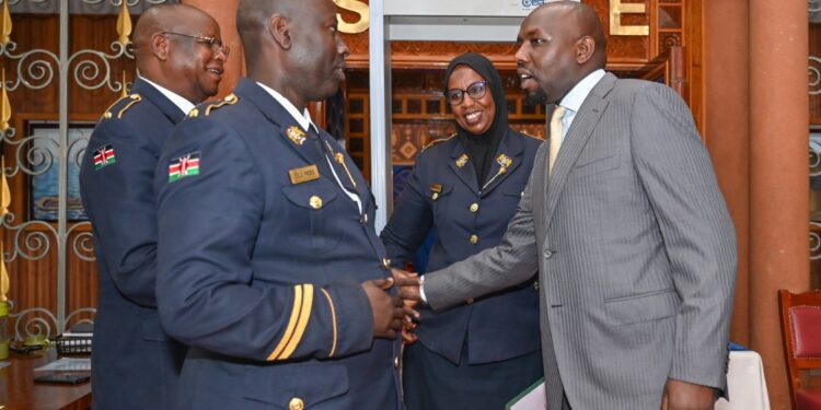 Transport Cs Kipchumba Murkomen (Right0 Greets Staff At Parliament Buildings In Nairobi.