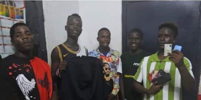 The Suspects Displaying An Id Card After Their Arrest. 