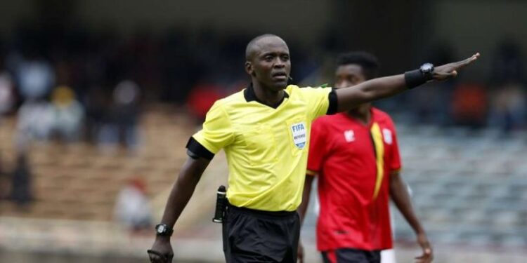 Peter Waweru Officiating The Match As A Center Referee. 