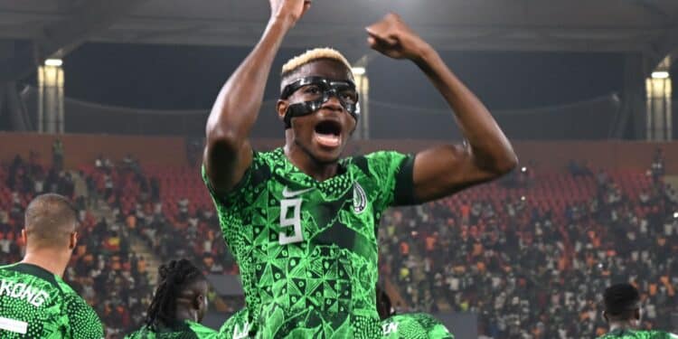 Reasons Why Victor Osimhen Wears A Face Mask Nigeria Striker, Victor Osimhen Wearing A Face Mask Celebrating A 2-0 Win Against Cameroon.