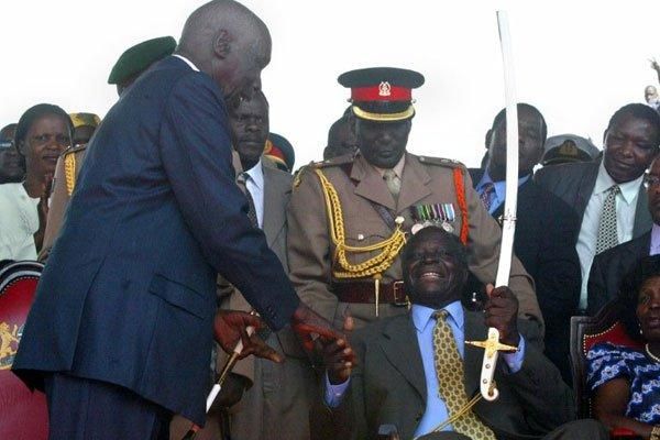 Kenya'S Second President Daniel Arap Moi 9Left0 Hands Over Power To His Successor Mwai Kibaki At Uhuru Park In December 2002. 