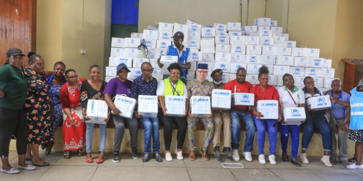 Government Spokes Person Distributing Unhcr To Embakasi Affected Victims