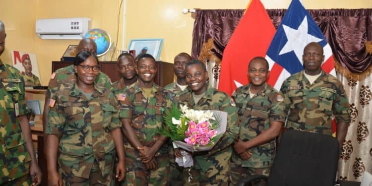 Meet Geraldine George; First Woman Appointed Liberia’s Defense Minister Geraldine George With Her Fellow Soldiers.
