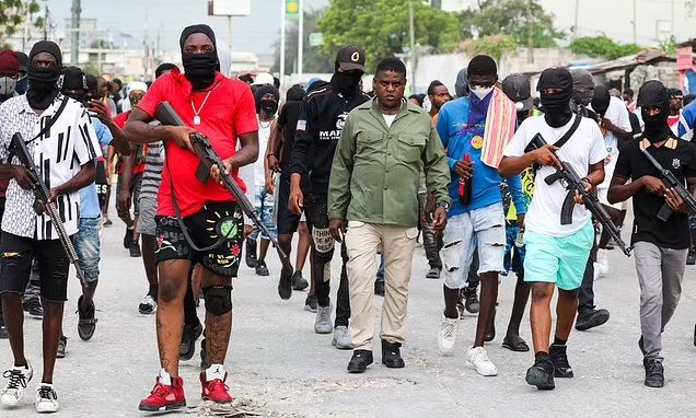 Gang Leader Jimmy Cherizier With His Team Walking In Streets Of The Haiti Capital Of Port-Au-Prince. Photo/Courtesy.