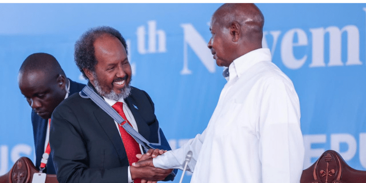 Ugandan President Yoweri Kaguta Museveni (Right) Welcomes The President Of The Federal Republic Of Somalia, Hassan Sheikh Mohamud After The Summit Of Eac Heads Of State Admitted Somalia To The Bloc During Their 23Rd Meeting Held In Arusha, Tanzania. Photo/Eac.