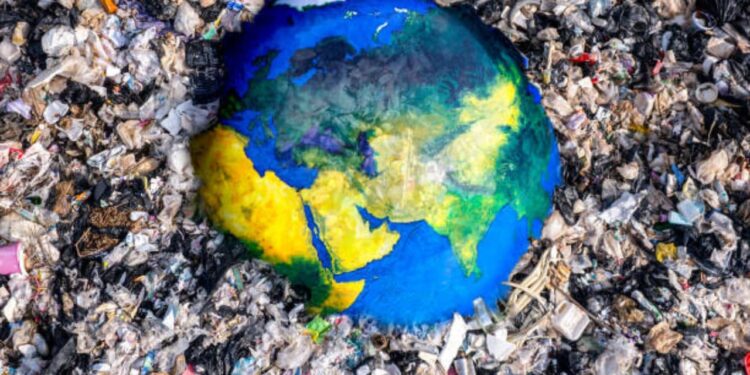 Concept Of The Earth Immersing In Plastic Waste. Photo/Courtesyplastic Pollution