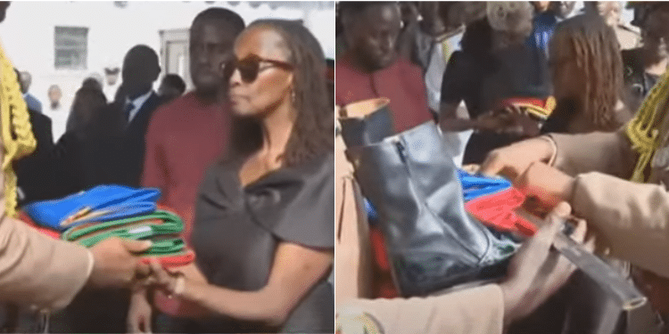 A Screen Grab Of National Flag And Service Boots Handed Over To Cdf'S Widow Eileen Ogolla. Photo/ Courtesy