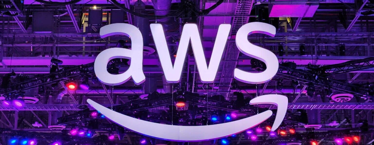 An Aws Sign Over The Show Floor At Reinvent 2023 In Las Vegas. Photo/ Courtesy