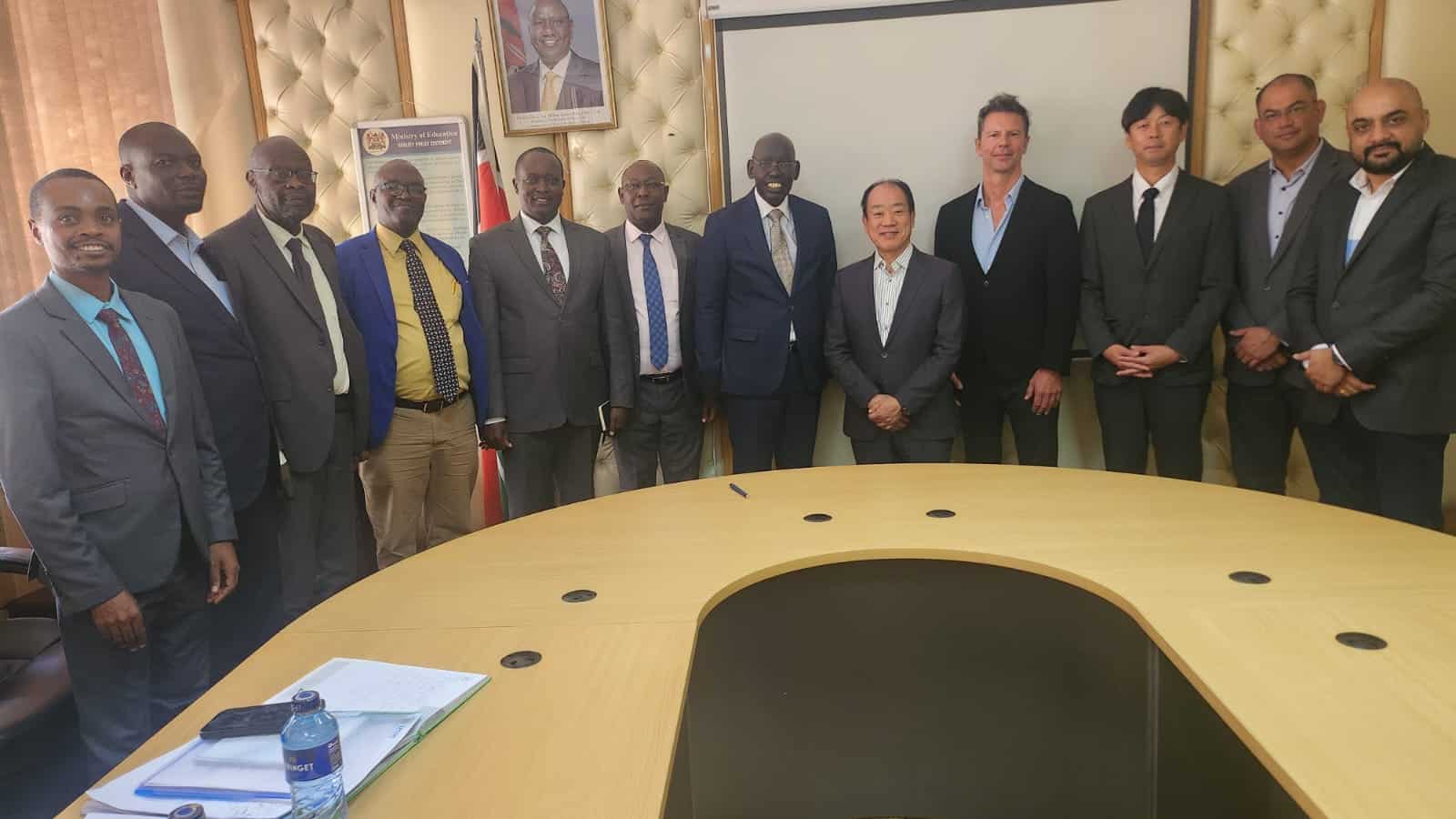 Ps Belio Kipsang And Seiko Epson Ceo (Centre) Pose For Group Photo With Officials From The Ministry And Epson Company. Photo/Min Of Edu