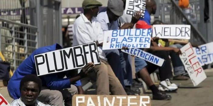 An Image Of Jobseekers Holding Placards Along A Road. Photo/ Nairobi County Govt