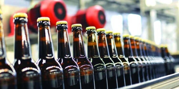 Eabl Warns Of Mass Layoffs In Kenya Over Proposed Finance Bill Taxes Beer Bottles On An Assembly Line. Photo/Courtesy