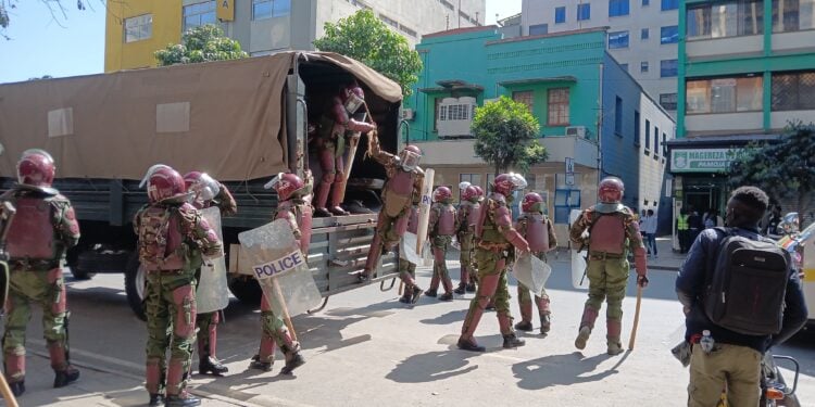 Breaking: Section Of Kenyan Parliament Set On Fire Anti-Riot Police Officers In Nairobi Cbd On Tuesday, June 25, 2024. Photo/The Kenya Times.