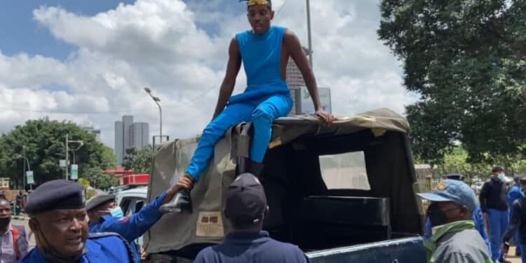 Comedian Eric Omondi Being Arrested While Protesting High Cost Of Living In Nairobi Cbd. Photo/Courtesy.