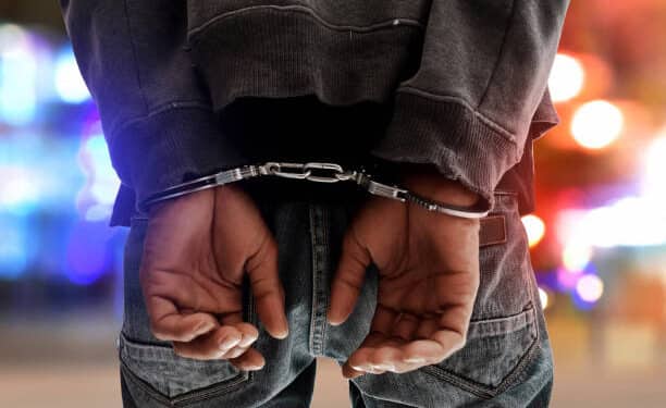 A Man In Cuffs. Photo/ Courtesy