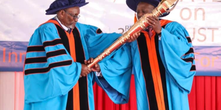 Open University Chancellor James Mwangi (Right) Receiving The Instrument Of Power After His Appointment. Photo/Moe.