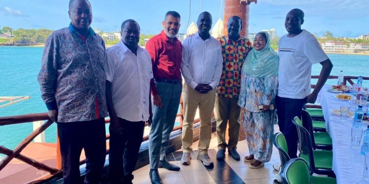 Odm Leader Raila Odinga (Third From Right) Poses For A Photo With Party Members In Mombasa. 