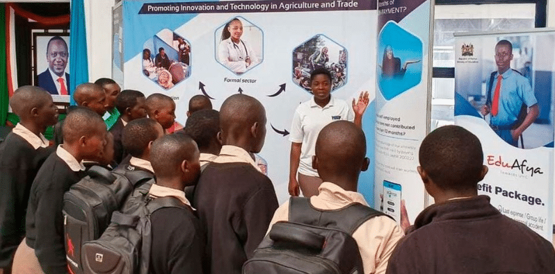National Hospital Insurance Fund Official Engaging School Pupils On Edu-Afya At The Nairobi Ask Show. Photo/ Nmg